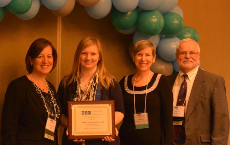 VCU Gerontology's Jennifer Pryor and Dr. Inker receiving the Accreditation plaque at the NAB meeting in Atlanta